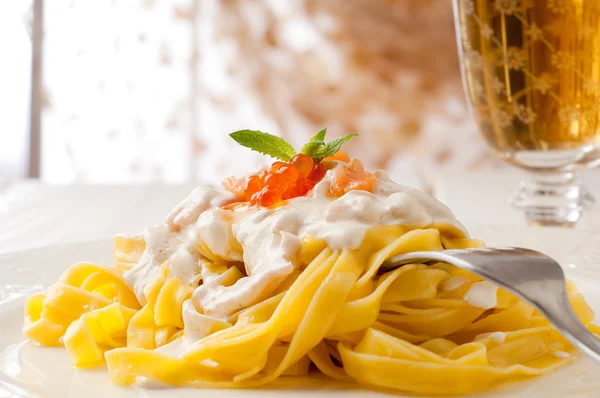 stock image Pasta with salmon and cream sauce