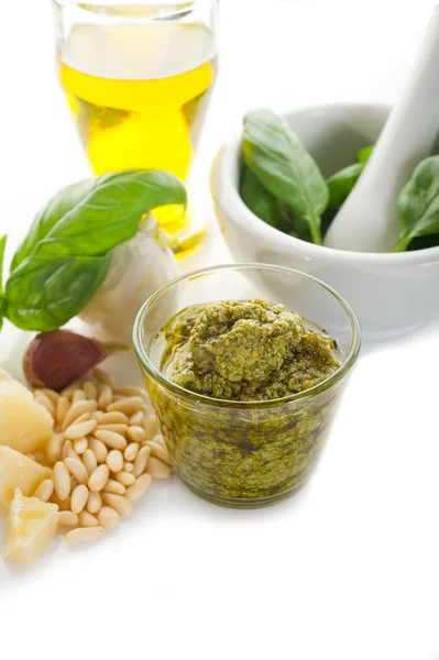 Pesto sauce with ingredients on white background — Stock Photo, Image
