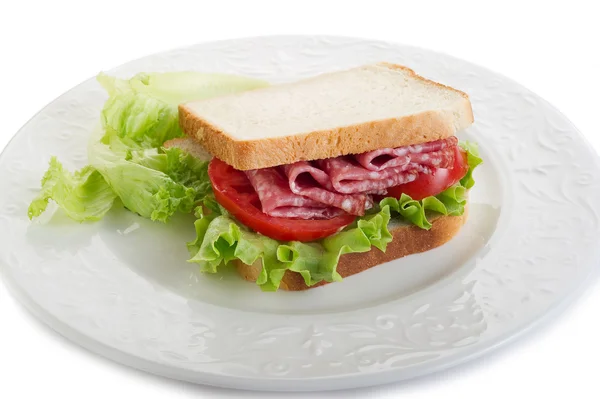 Sandwich with salami and lettuce — Stock Photo, Image