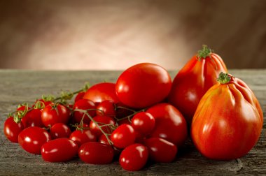 Tomatoes on wood background clipart