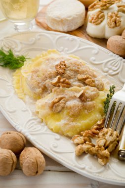 Ravioli with nuts and cream sauce clipart