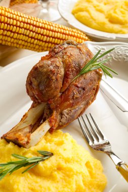 Shank with polenta clipart