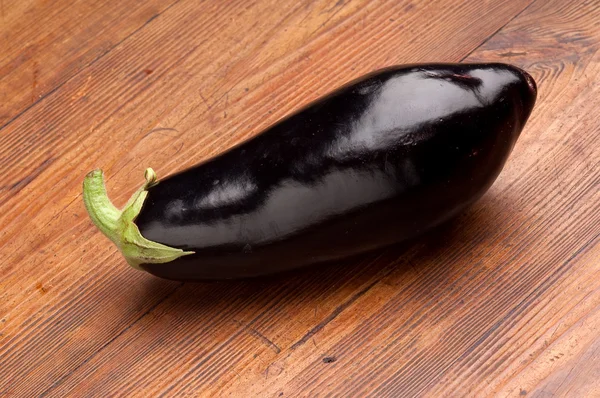 Eggplant on wood background — Stock Photo, Image