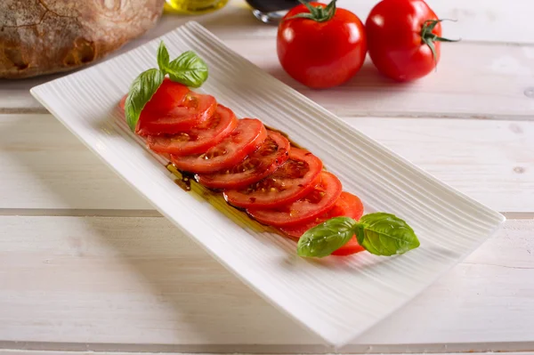 stock image Sliced tomatoes on dish