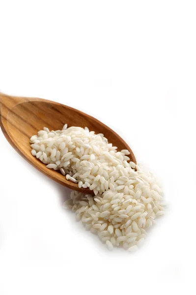 Roher Reis auf weißem Hintergrund — Stockfoto