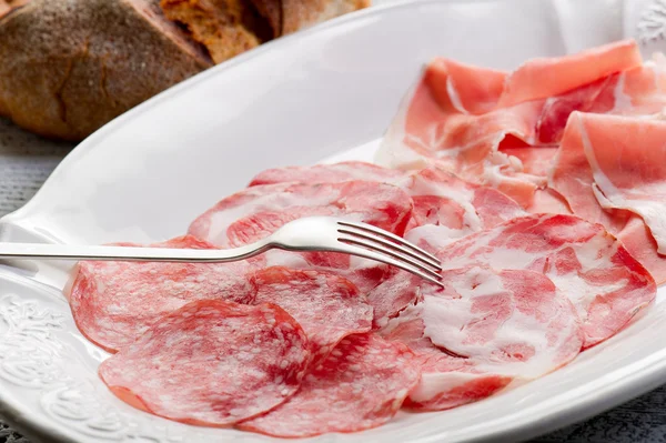 Variety of salami and ham — Stock Photo, Image