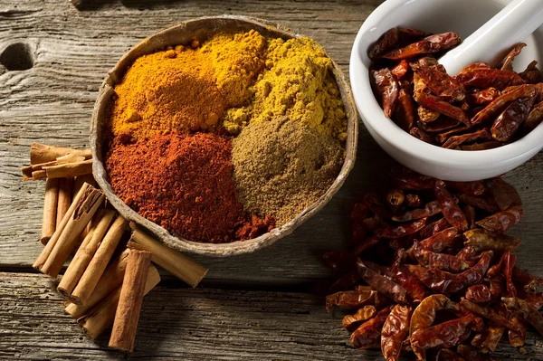 Variety of spice on wood background — Stock Photo, Image