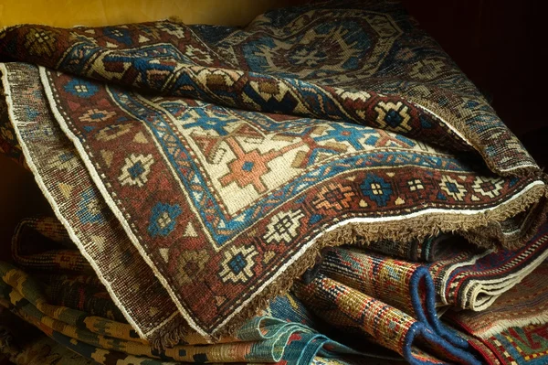 Variety of ancient oriental carpets — Stock Photo, Image