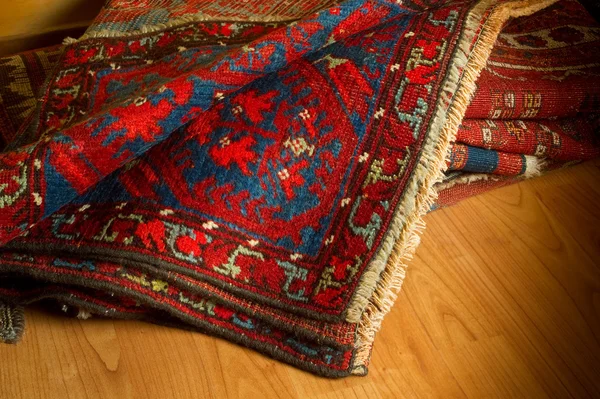 Variety of ancient oriental carpets — Stock Photo, Image