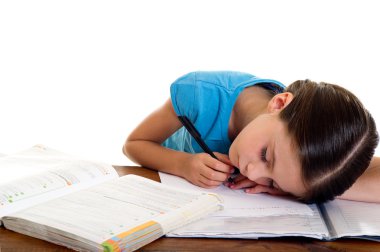 Child sleeps while she studies clipart