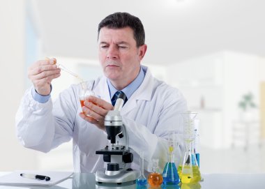 Technician working at laboratory clipart