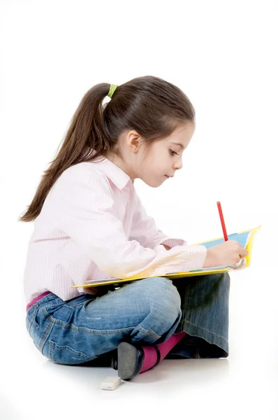 Mała dziewczynka studiuje — Zdjęcie stockowe