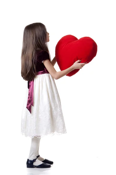 Маленька дівчинка з червоним серцем — стокове фото