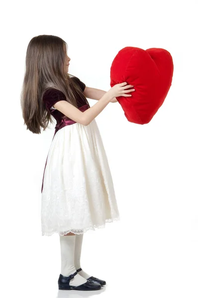 Маленька дівчинка з червоним серцем — стокове фото