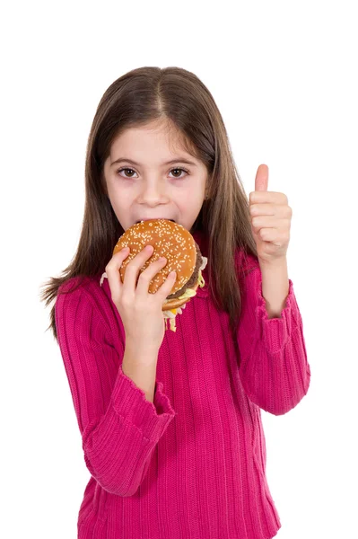 Hamburger yiyen küçük kız — Stok fotoğraf
