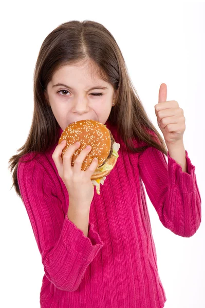Dziewczynka jedzenie hamburgerów — Zdjęcie stockowe