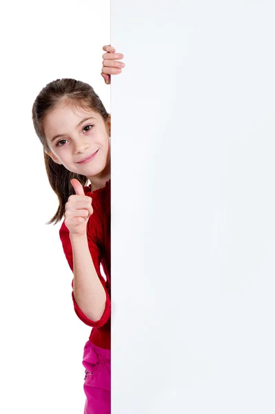 Sorrindo menina com polegar para cima segurando placa vazia — Fotografia de Stock