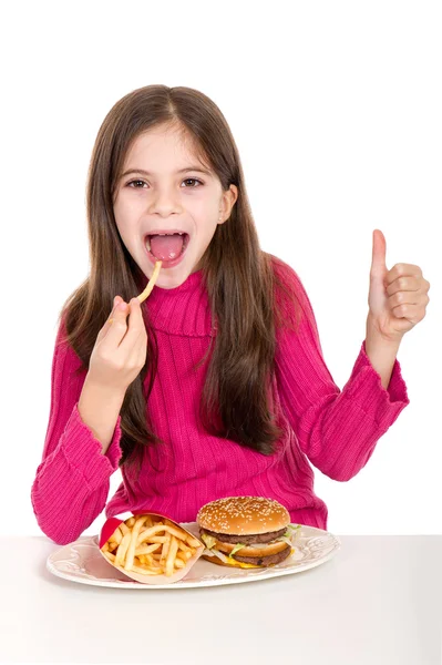 Hamburger yiyen küçük kız — Stok fotoğraf