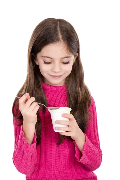 Holčička jíst jogurt — Stock fotografie