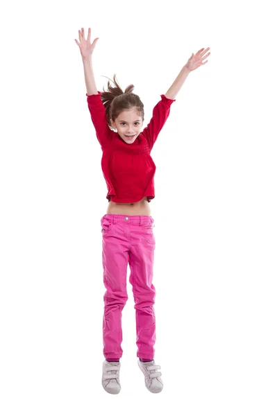 Malá dívka, která skočila na bílém pozadí — Stock fotografie