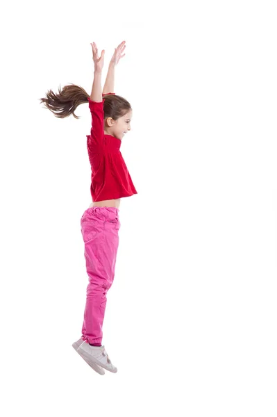 Литтель девушка прыгает на белом фоне — стоковое фото