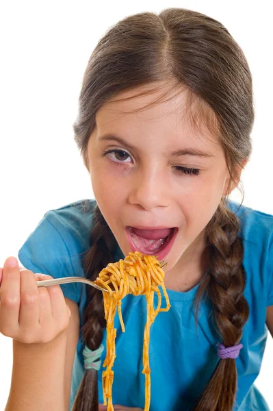 Cute little girl jedzenie spaghetti — Zdjęcie stockowe