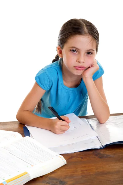 Uttråkad liten flicka som studerar — Stockfoto