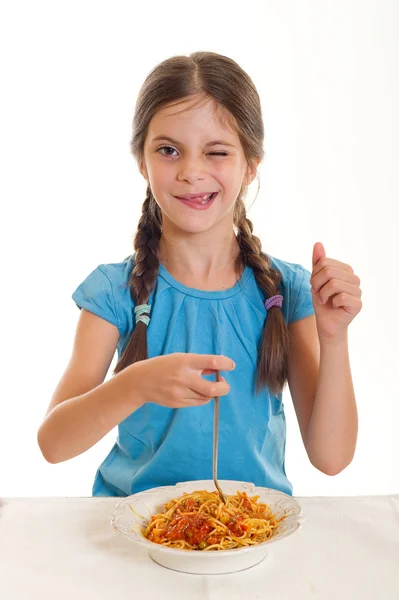 Cute little girl eating spaghetti — Stock Photo, Image