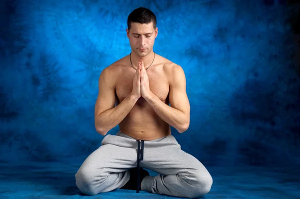 Man on yoga position — Stock Photo, Image