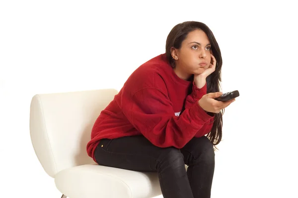 Bored girl with remote control — Stock Photo, Image