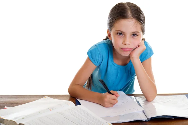 Bored little girl studying Royalty Free Stock Photos