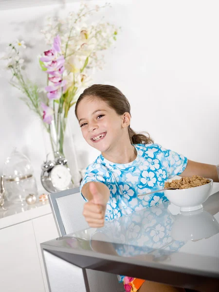Little girl at breakfast time — Stock Photo, Image