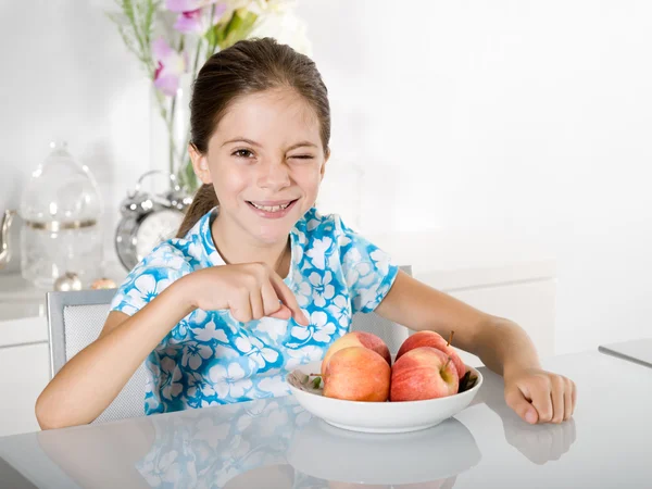 Little girl with red apple — Stock Photo, Image