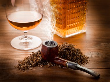 Smoking pipe, tobacco and liquor clipart