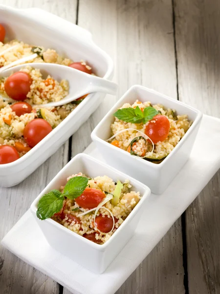 Vegetable couscous with cherry tomatoes and mint leaf — Stock Photo, Image