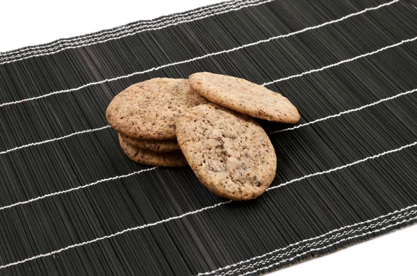 Some cookies on a black backhander — Stock Photo, Image