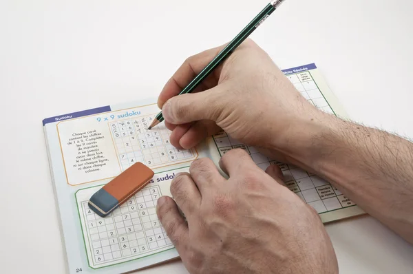 Sudoku game with right hand writer — Stock Photo, Image