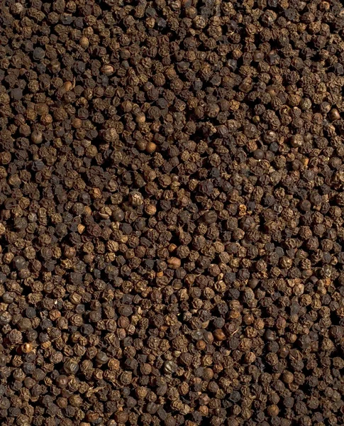 Μαύρο πιπέρι καρύκευμα φόντο — Φωτογραφία Αρχείου