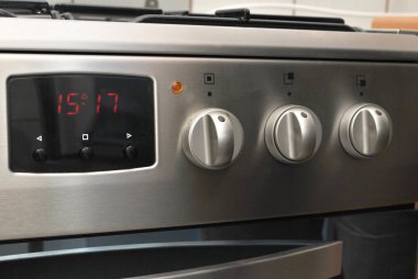 Oven with digital clock clipart