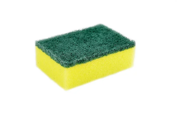 Um prato de esponja amarelo isolado em branco — Fotografia de Stock