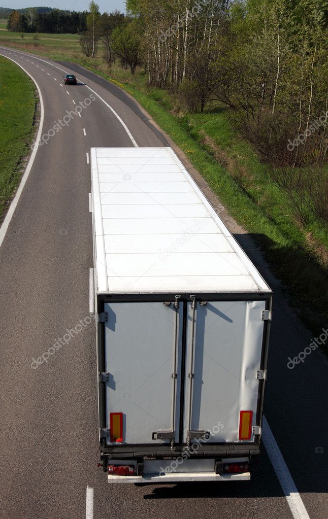 White truck driving on country-road
