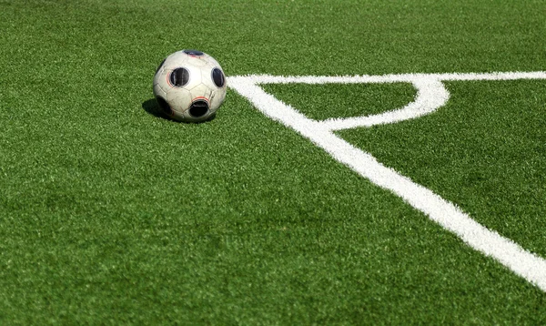 A soccer ball in stadium, corner- selective focus — Stock Photo, Image