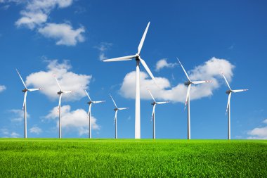 Wind Turbines on green field clipart