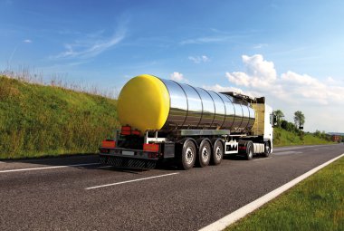 Oil transporting lorry on the road clipart