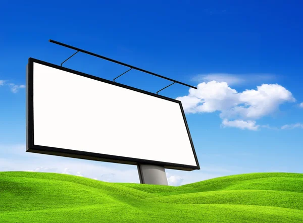 Blank billboard on green meadow — Stock Photo, Image