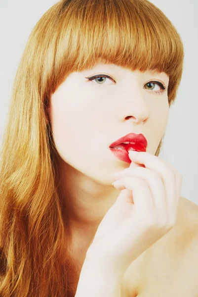 Sexig kvinna med en röd godis — Stockfoto