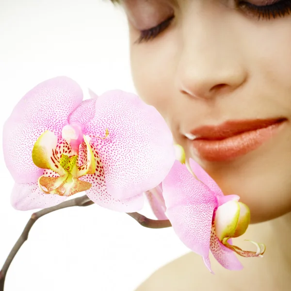 Woman and orchid — Stock Photo, Image