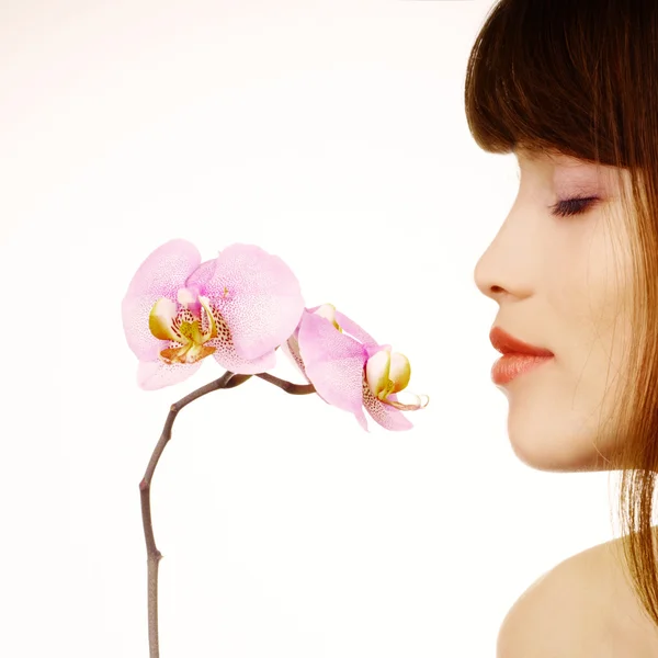 Woman and orchid — Stock Photo, Image