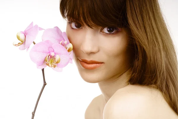 Woman with an orchid — Stock Photo, Image