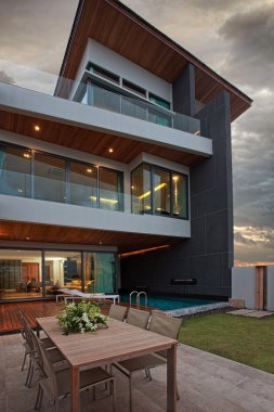 CView of nice modern villa in summer after sunset environment